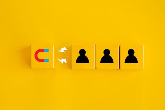 Magnet attracting new customers in yellow background.