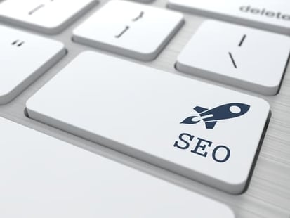 Photo of a keyboard, with a key that says SEO and a rocketship.